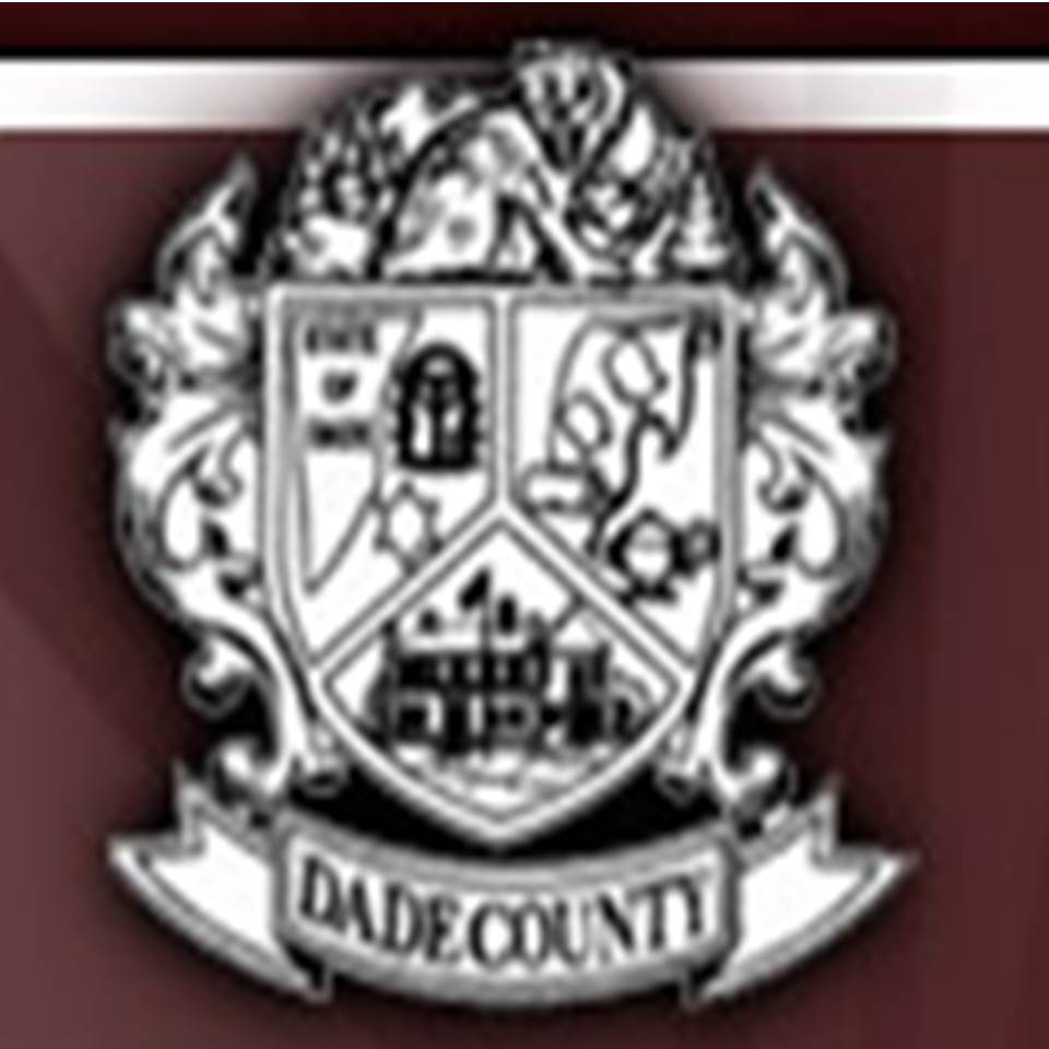 Dade County Schools logo and illustration on a maroon background